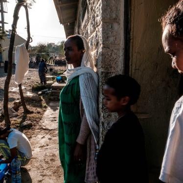 Displaced people from Western Tigray stand outside a school where they are sheltering in Mekele, Ethiopia, February 24, 2021.